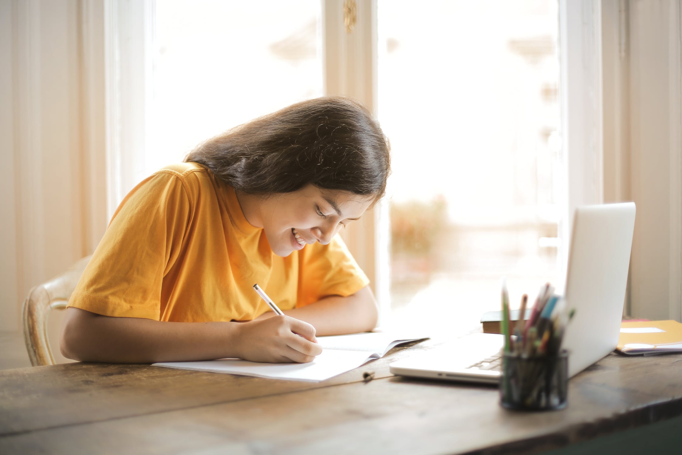 photo of BHS Student writing her senior paper